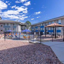 Pergolas and outdoor seating area at the Sedona Ridge Apartments, located in Colorado Springs, CO.